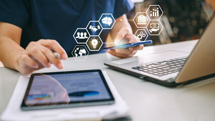 Businessman working on project for SWOT analyzing company financial report balance with augmented reality graphics at modern office space. Concept for business, economy, marketing and strategy.
