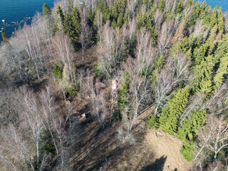View of the old border observation tower on the island near the Hara submarine base from a height from a drone.