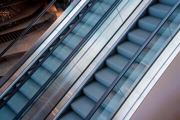Naklejka na ściany i meble Modern automatic escalator system in shopping mall