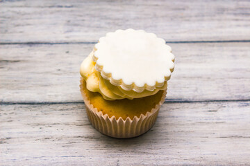 Cupcake with white cream, cupcake is a small cake baked in a cup-shaped container.