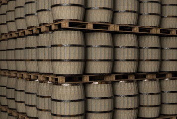 Stack of wooden wine barrels on black background.