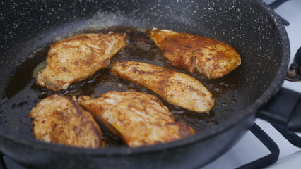 frying pan with chicken meat