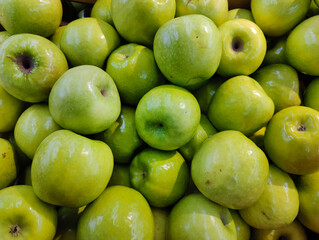 lot of green apples on the market