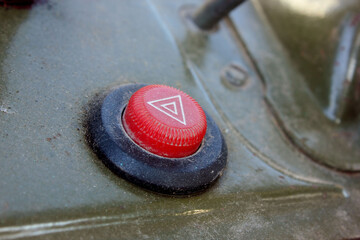 Emergency button on the car panel. The button for turning off, turning on the emergency mode in the car. Background, car emergency button.