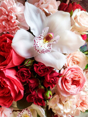 Bouquet of flowers, roses and lilies, bright colorful floral arrangement. Posy. Pink and white flowers. floral arrangement. Beautiful bouquet, gift, sign of attention