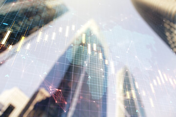 Double exposure of abstract financial chart with world map on office buildings background, research and analytics concept