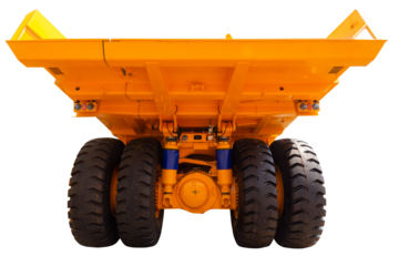 Huge rear wheels of dump truck at unusual angle closeup.