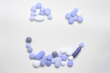 Assorted pills on a neutral background with light blue colors. Concept of pills used for male erection.