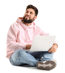 Handsome bearded man with laptop on white background