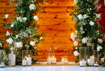 Wedding ceremony. Wedding arch decorated with white flowers. A very beautiful, stylish wedding arch stands in the ceremony area. wedding day.