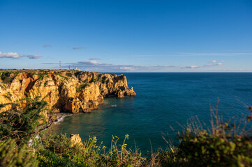 Fototapeta na wymiar Cliffs and Lighthouse of Sagres, Algarve Portugal
