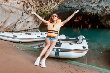 girl at the excursion boat in the cave lake appears to be quite adventurous as she explores the...