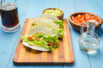 Mexican tacos with vegetables and meat.