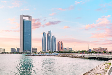Obraz premium unique and contemporary designs of the skyscrapers in this photo define Abu Dhabi modern skyline. With each building competing in height and grace, it's a true feast for the eyes.