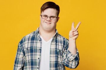 Young happy fun cool smiling man with down syndrome wears glasses casual clothes look camera...