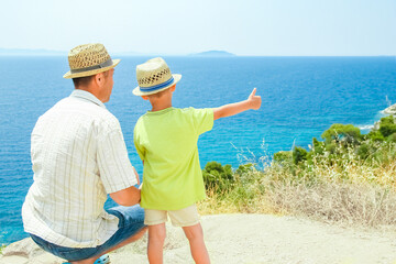 A hands of happy parents and children at sea in travel background in greece