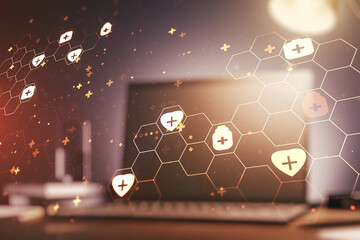 Double exposure of creative abstract medical hologram on laptop background. Healthcare technolody concept