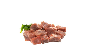 Pile of raw pork meat isolated on white background. Very used for stews.