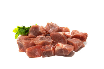 Pile of raw pork meat isolated on white background. Very used for stews.