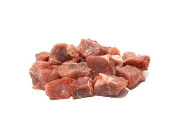 Pile of raw pork meat isolated on white background. Very used for stews.