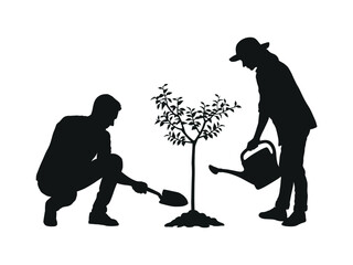 Man digging ground with shovel, planting a tree and woman watering plant silhouette image.