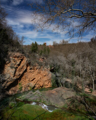 Mountainous landscape with river and cloudy sky