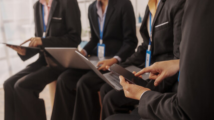 Group of four asian business people only women bookkeepers brainstorm in a meeting plan development, audit, balance sheet, manager and an employee communicating with full team.
