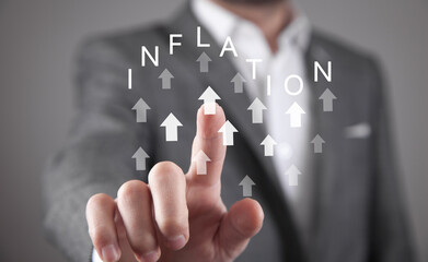 Man showing Growing arrows with a word Inflation.