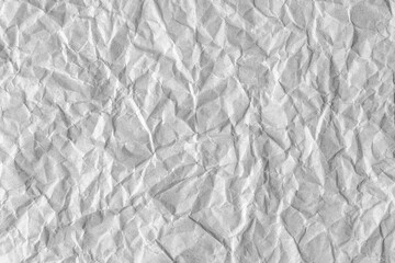 Recycled crumpled gray paper texture background. Wrinkled and creased abstract backdrop, wallpaper with copy space, top view.