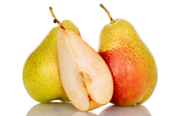Two whole and a slice of juicy organic pear, close-up, on a white background.