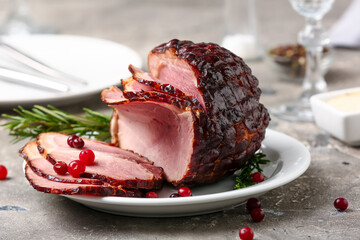 Plate with tasty smoked ham on grey grunge background