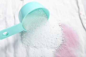 Laundry detergent on stained clothes, closeup