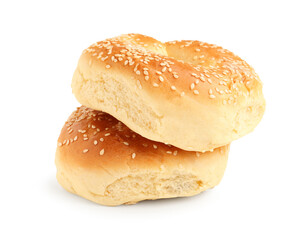 Tasty bagels with sesame seeds on white background