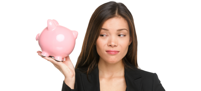 Piggy bank savings with unhappy funny woman looking displeased at pink piggy bank isolated on white background. Business woman or banker wearing suit jacket. Isolated on transparent PNG background.