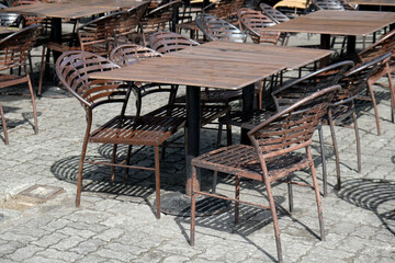 tables and chairs on the street, Manila