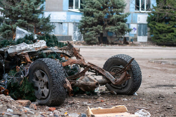 Remnants of a civilian car after Russian missile strikes on Ukraine. A destroyed car. "Russian World". The war in Ukraine.