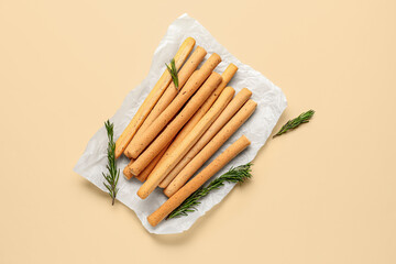 Tasty Italian Grissini on yellow background