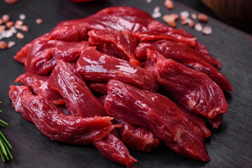 Fresh raw beef with salt, spices and herbs
