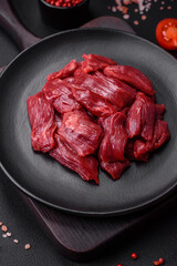 Fresh raw beef with salt, spices and herbs