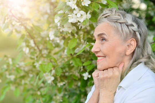 happy smiling old woman posing outdoors