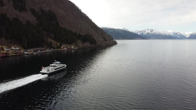 Aerial shot of Ferry leaving dock at Vik&oslash;yri, in Vik i Sogn, Norway.