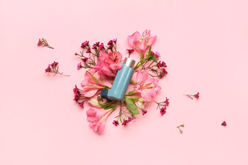 Asthma inhaler with flowers on pink background - obrazy, fototapety, plakaty