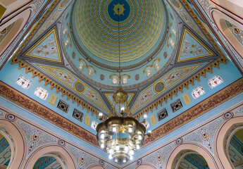 View into the painted dome inside the Jumeirah Mosque in Dubai open to all visitors