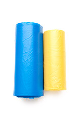 Blue and yellow rolls of garbage bags isolated on white background