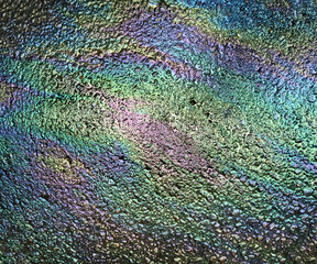 Oil stain on asphalt, color gasoline fuel spots on Asphalt Road as texture or background - 590900710