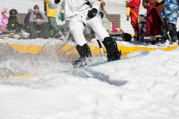 Snowboarder on a snowboard.Snowboarding down the mountain with overcoming .