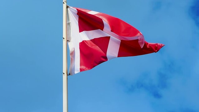 Flag of Denmark. Waving Denmark Flag, 4K video. National Danish flag in the sky of Denmark