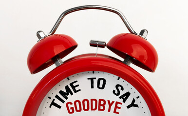 Red alarm clock with text Time To Say Goodbye