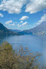 Obraz premium Como city in Italy, view of the city from the lake, with mountains in background 