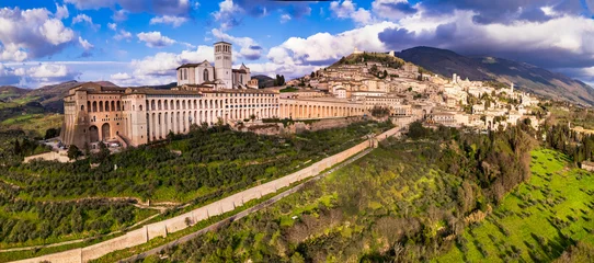 Gardinen Impressive medieval Assisi town in Umbria over sunset. Italy.  aerial drone panoramic view. italian travel and best destinations © Freesurf